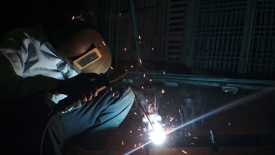 Welder fabricating metal in a workshop